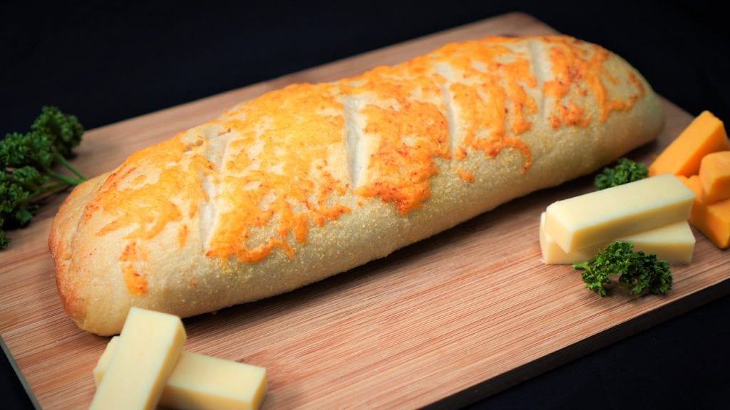 Addictive Domino’s Cheesy Bread Copycat Recipe - homemade cheesy bread with garlic powder and butter