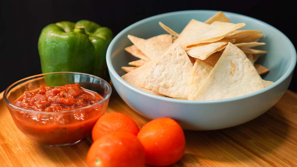 Copycat Chili's Tortilla Chips Recipe - crunchy baked flour tortilla chips with salsa dip