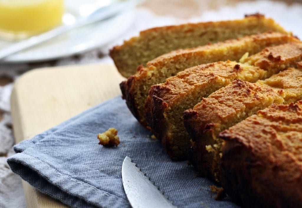 pumpkin bread on a blue kitchen towel