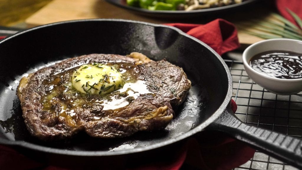 Rosemary Ribeye Steak Recipe- Tender rosemary ribeye steak with a knob of rosemary butter and roasted vegetables.