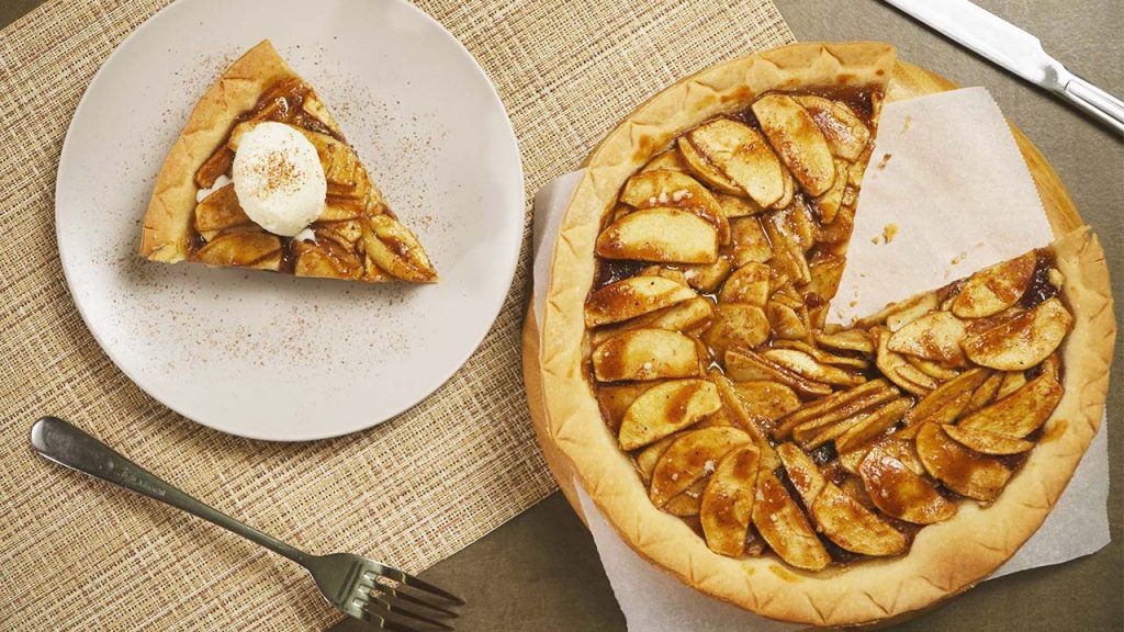 open face pie and a slice topped with ice cream