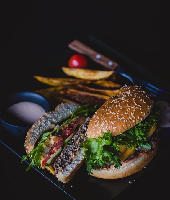 Bacon Cheeseburger (Red Robin Copycat) - homemade juicy bacon cheeseburger with meaty patties, crispy bacon, and gooey cheese, chips on the side