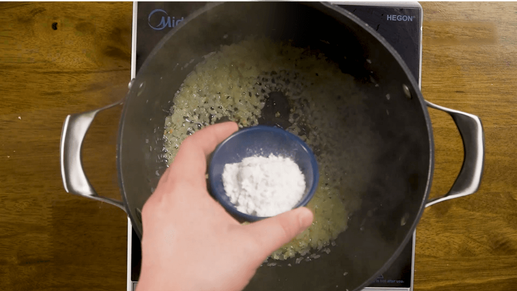adding flour to the pan
