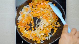 add the garlic and tomatoes