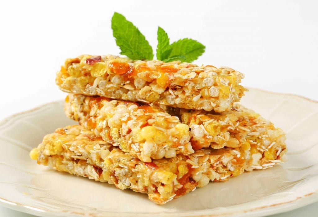 apricot oatmeal bars on a white plate