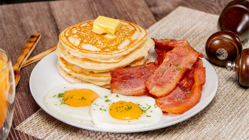 Classic Sunny Side Up Eggs with Bacon and Pancakes