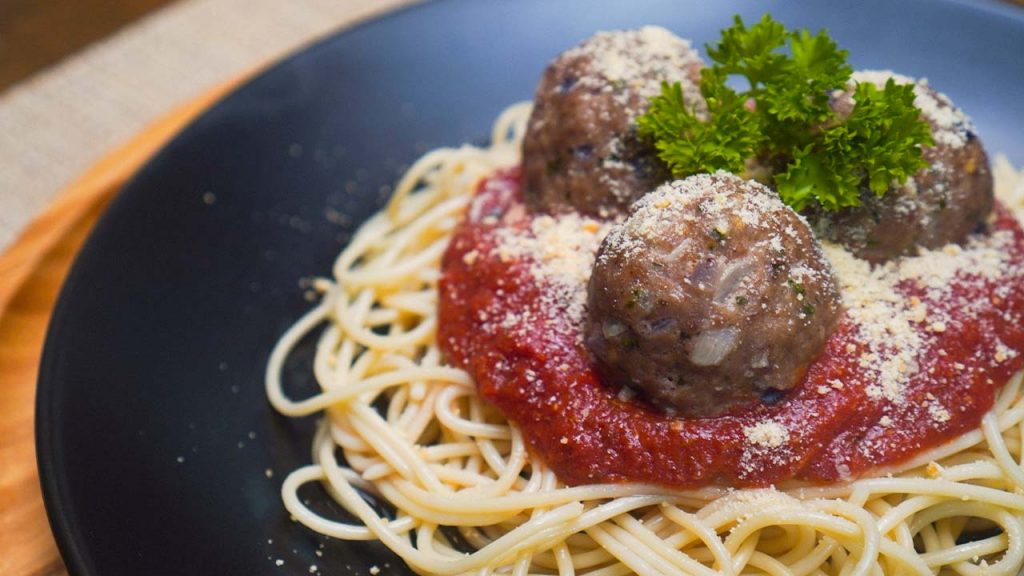 Carrabba’s Meatballs Recipe (Copycat), spaghetti and meaballs with marinara sauce, parmesan cheese, and parsley garnish