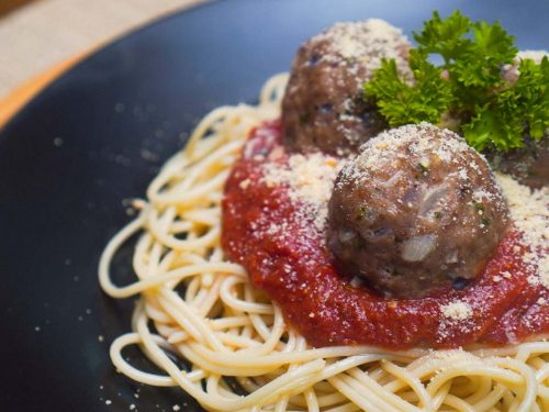 Carrabba’s Meatballs Recipe (Copycat), spaghetti and meaballs with marinara sauce, parmesan cheese, and parsley garnish