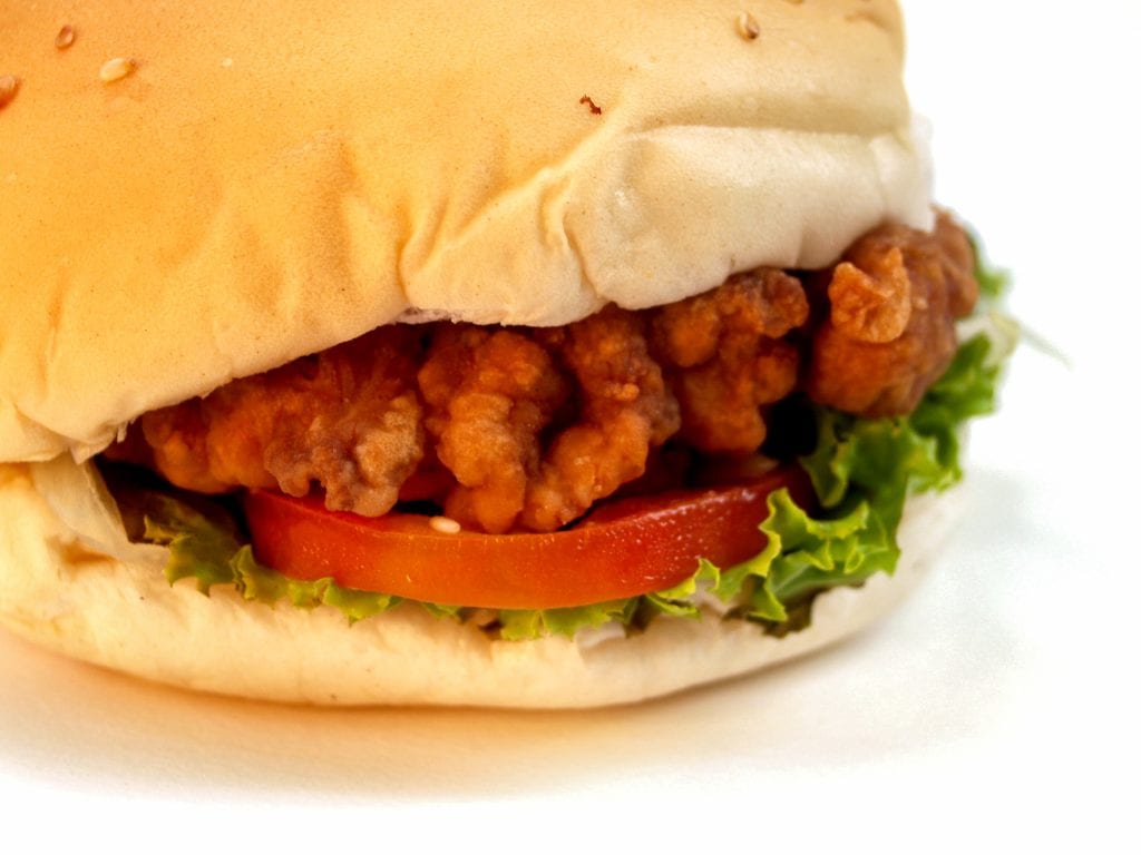 closeup on a fried chicken burger