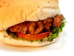 closeup on a fried chicken burger
