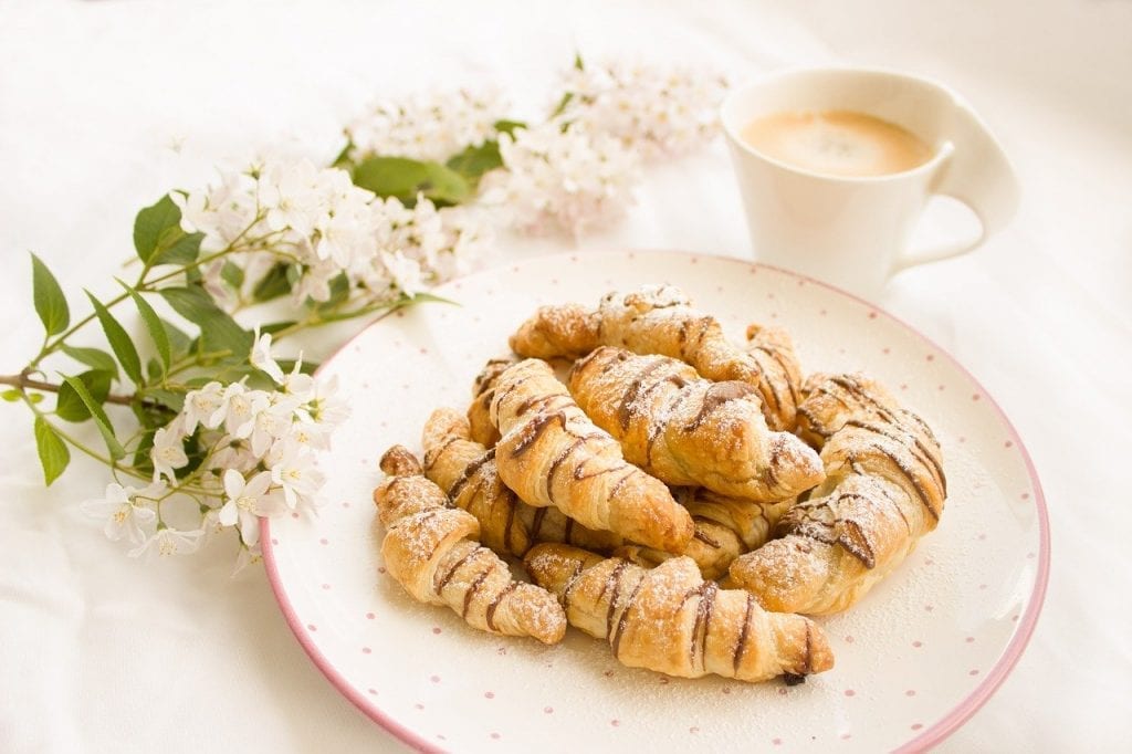 chocolate croissants covered with powdered sugar