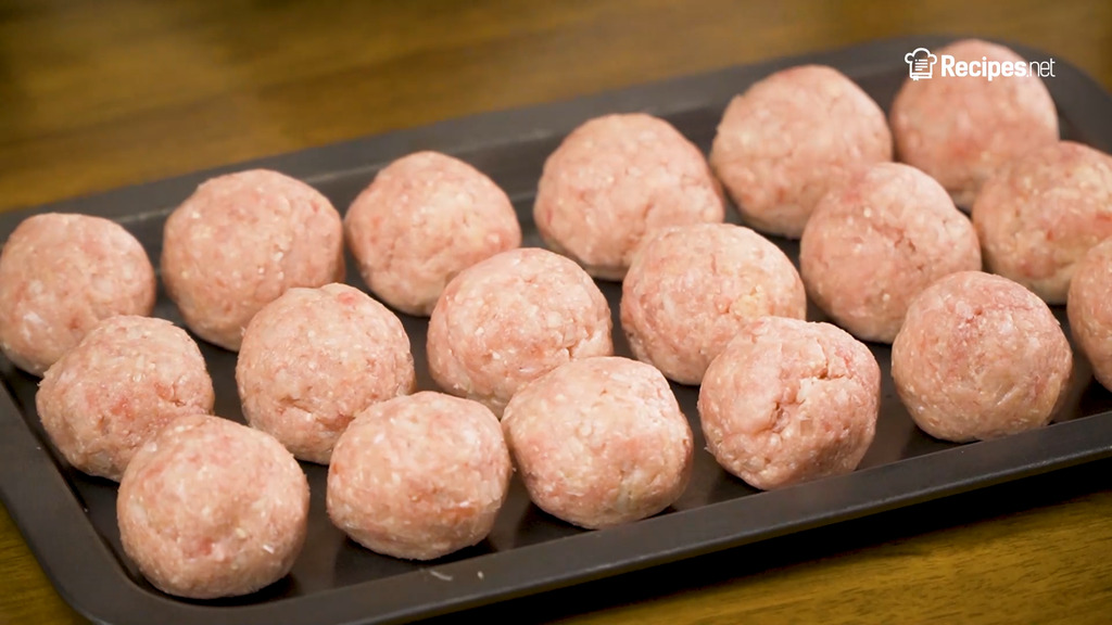 forming the meatballs, uncooked meatballs on a baking tray