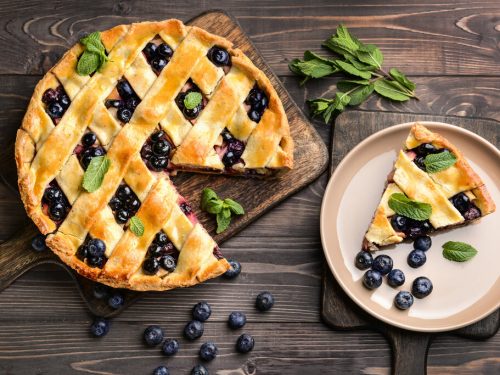 Humble Huckleberry Pie Recipe, huckleberry pie with woven lattice top and huckleberries