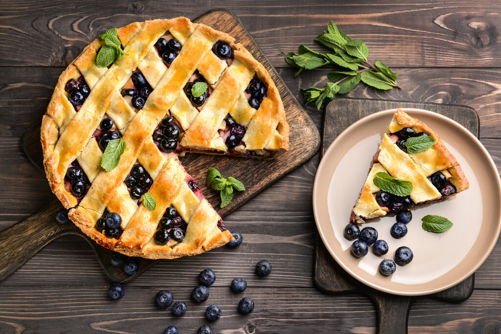 Humble Huckleberry Pie Recipe, huckleberry pie with woven lattice top and huckleberries