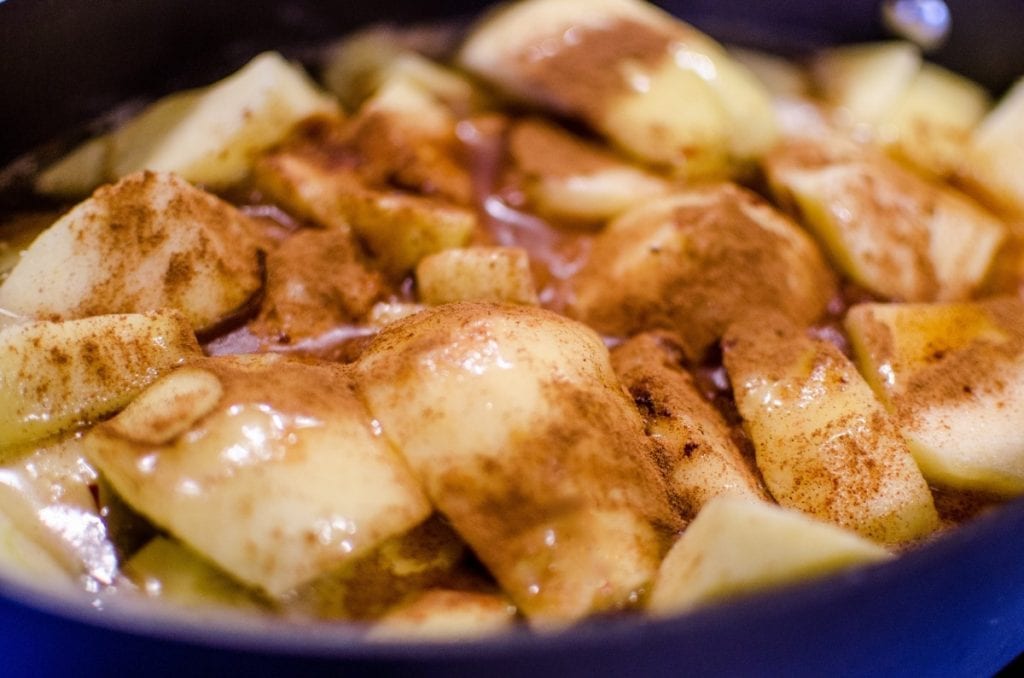 cooked sliced apples with cinnamon