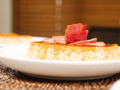 Mexican Tres Leches Flan Recipe, Flan with caramel syrup and strawberry rose on top