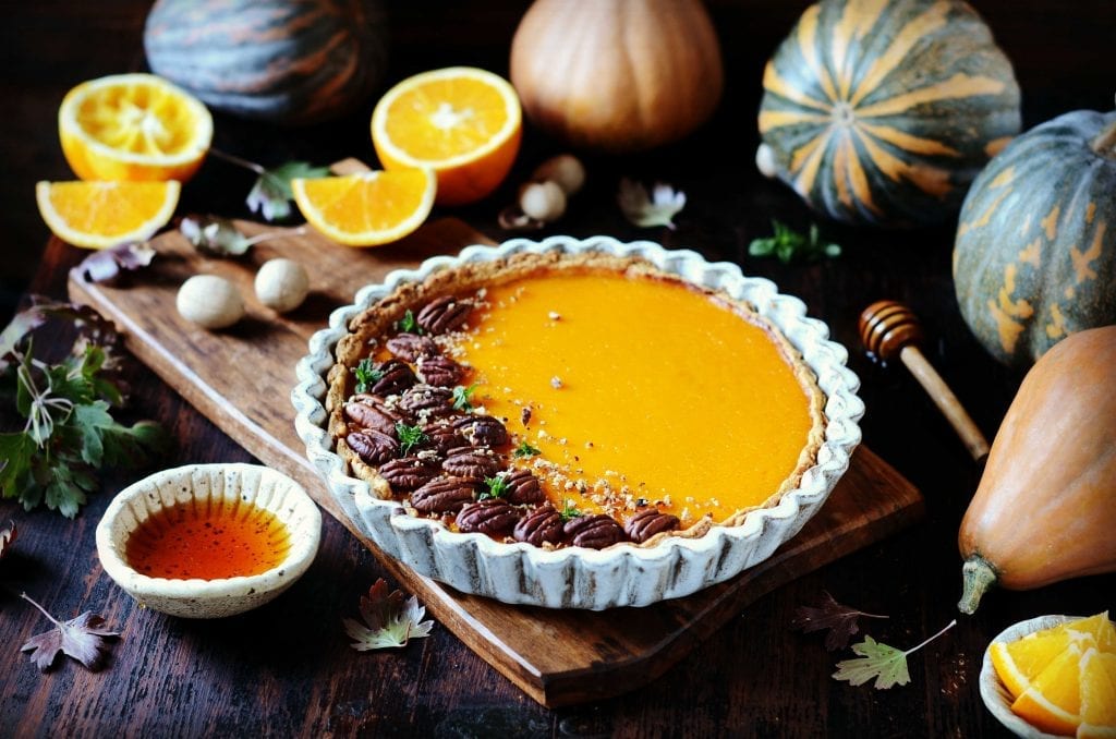 pumpkin pie topped with pecans