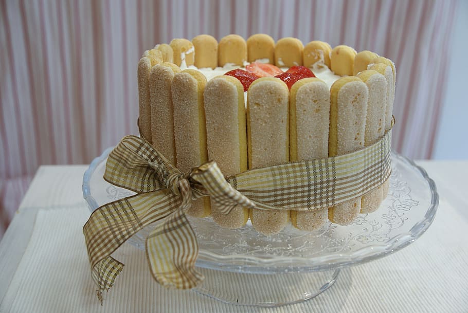 no-bake cake made with ladyfingers and tied with a ribbon in front