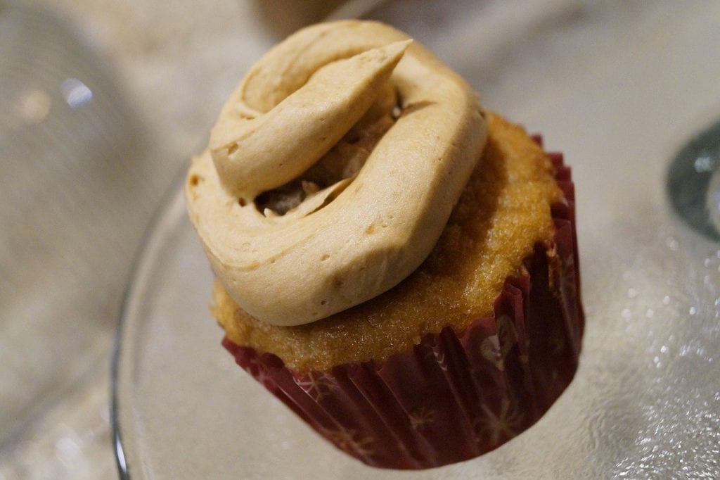 pumpkin cupcake with frosting swirled on top