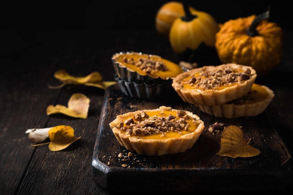 mini pumpkin pies with a nut topping