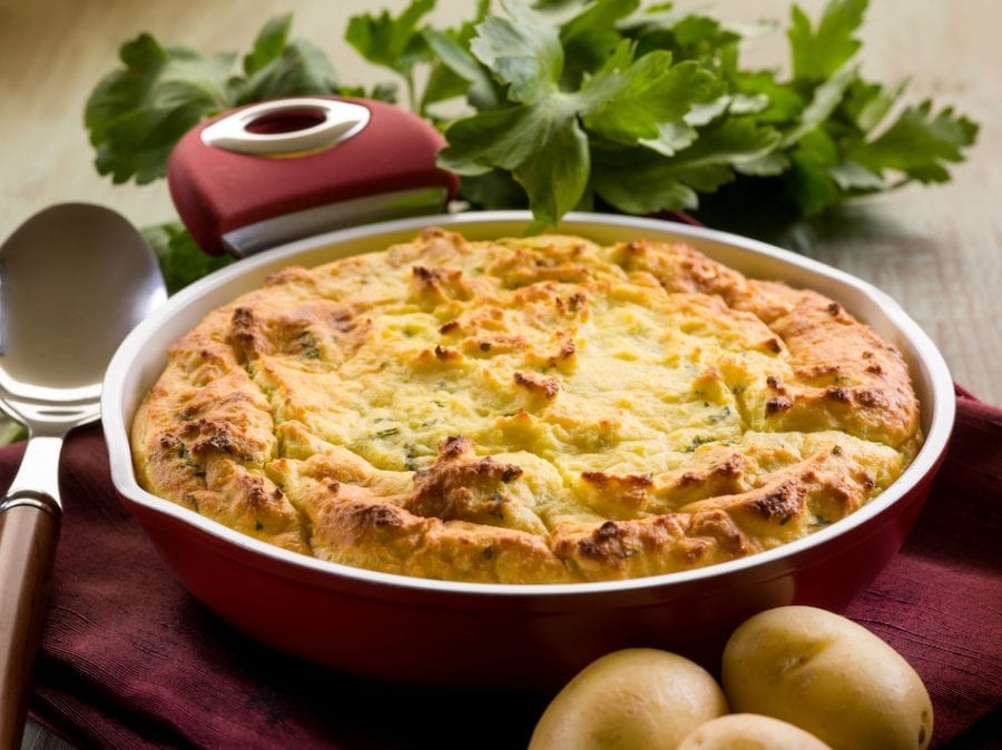 sweet potato chicken pie, spoon, potatoes, and herbs