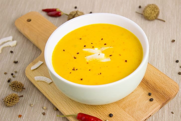 pumpkin soup topped with coconut flakes