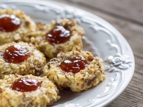thumbprint cookies with red center and covered in nuts
