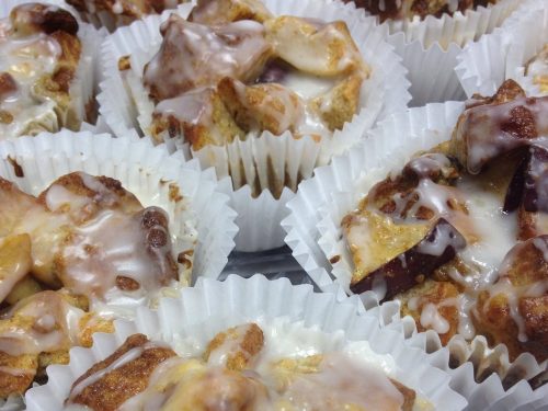 baked apple cinnamon bread pudding cups with an almond glaze