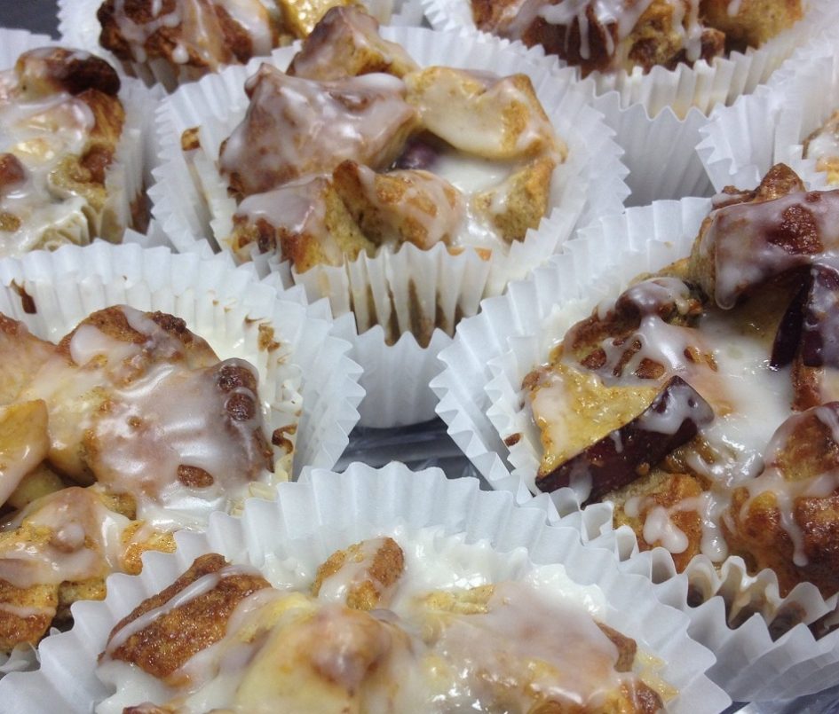 baked apple cinnamon bread pudding cups with an almond glaze