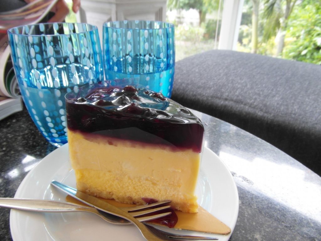 delicious black cherry cheesecake with sour cream topping