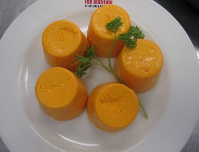 carrot and cheese timbales with red pepper sauce