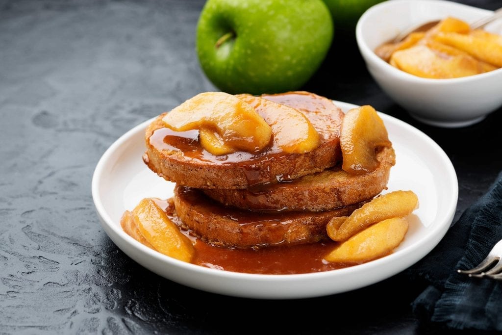 bread covered in caramel and apple slices