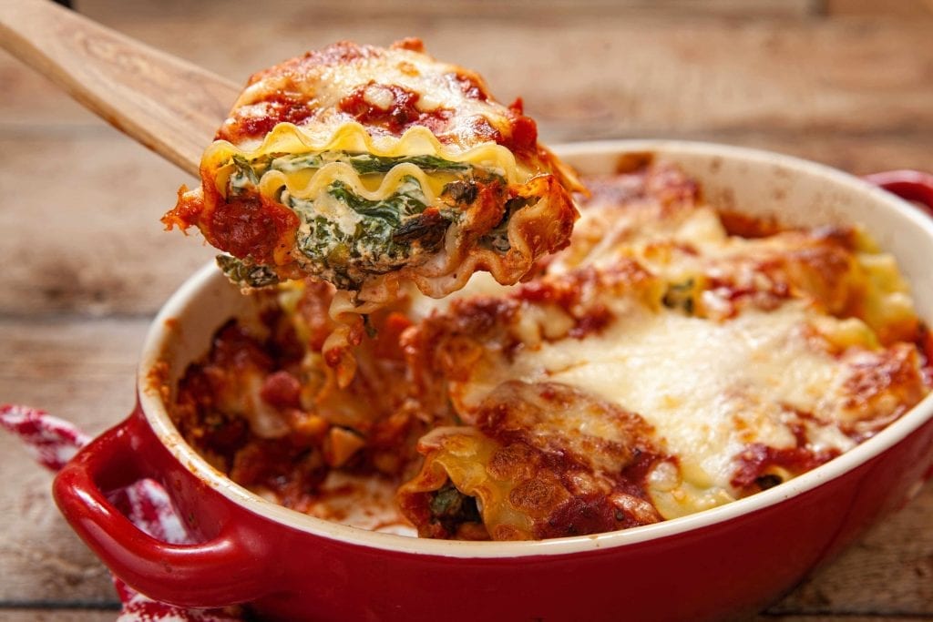 spinach lasagna made with tomato sauce and cheese