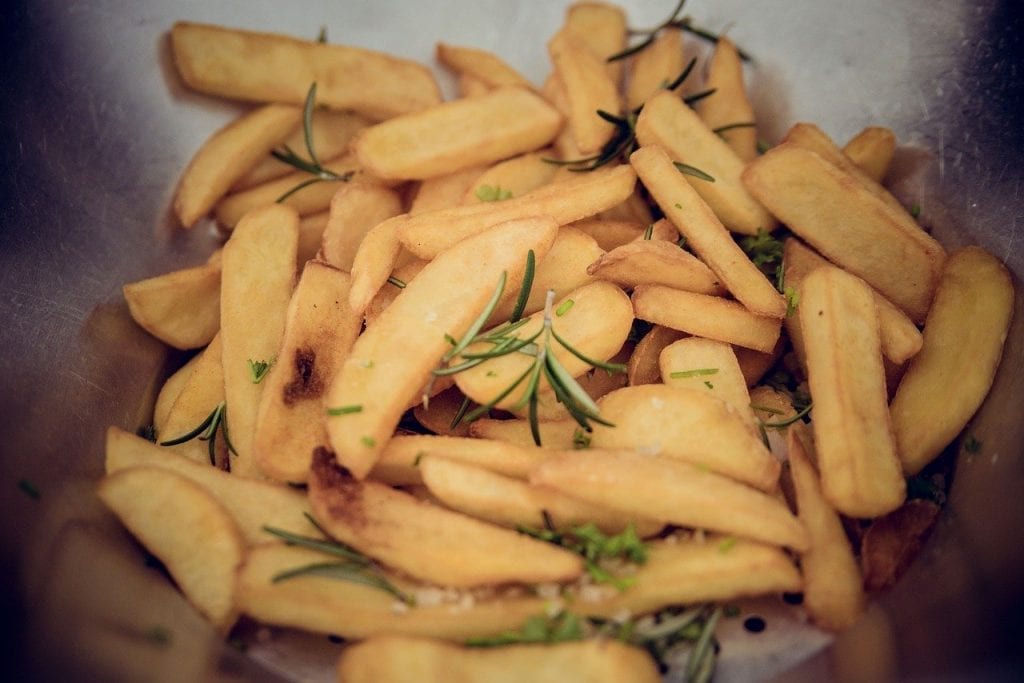 thick-cut fries with rosemary sprigs