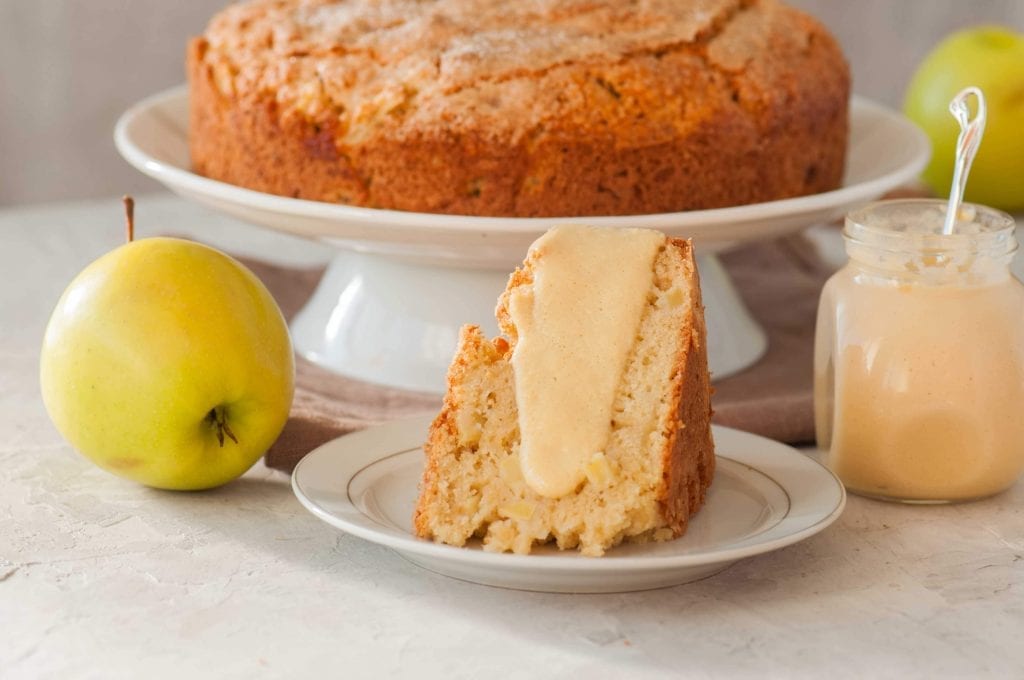 irish apple cake with custard and surrounded by green apples