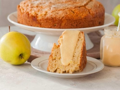 irish apple cake with custard and surrounded by green apples