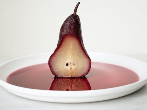 poached pears in mulled cranberry and sun dried cherry sauce