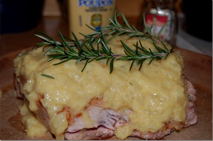 Pork Loin with Applesauce, Jelly, and Horseradish Recipe - Roasted pork loin glazed with a mixture of applesauce, redcurrant jelly, and horseradish, then garnished with rosemary sprigs