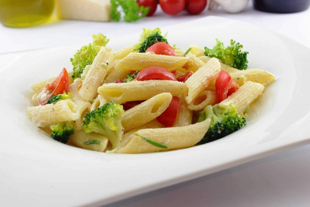 pasta with vegetables in a white plate