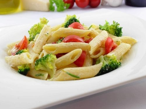 pasta with vegetables in a white plate