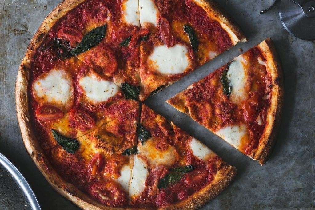 top view of a mozzarella and tomato pizza