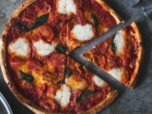 top view of a mozzarella and tomato pizza