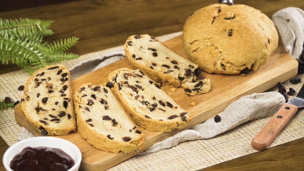 Mom's Irish Soda Bread - Warm and dense quick Irish soda bread recipe with raisins paired with jam, butter, or citrus marmalade