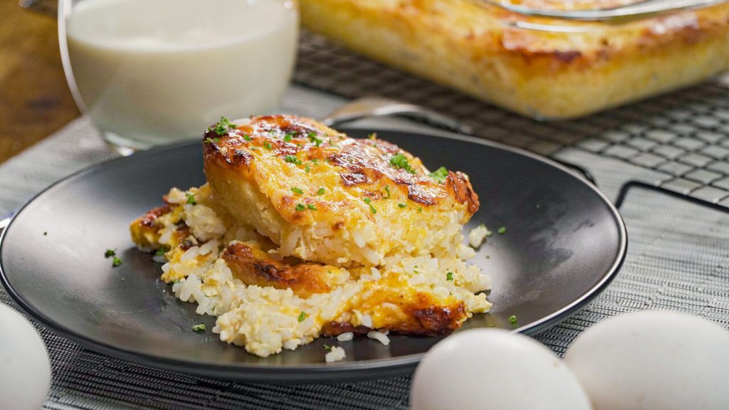 Cheese Rice Recipe, Rice baked with cheese with crunchy topping, served on a black plate