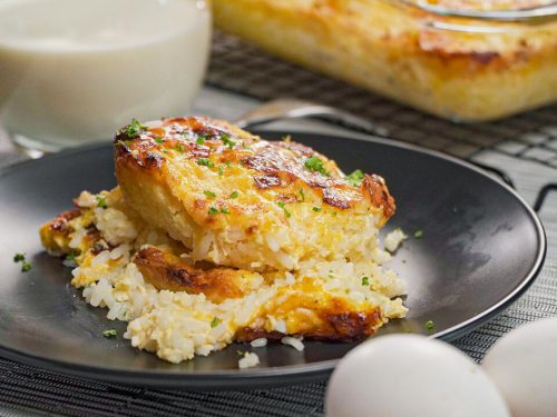 Cheese Rice Recipe, Rice baked with cheese with crunchy topping, served on a black plate