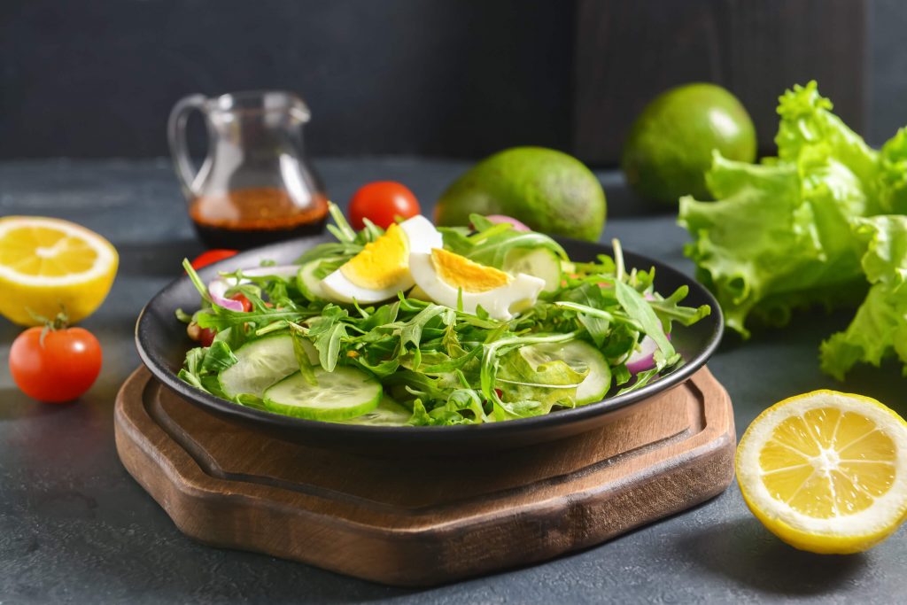 perfectly hard boiled eggs and wilted baby arugula and leek salad