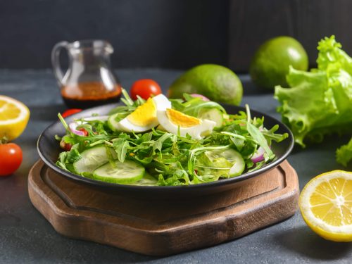 perfectly hard boiled eggs and wilted baby arugula and leek salad