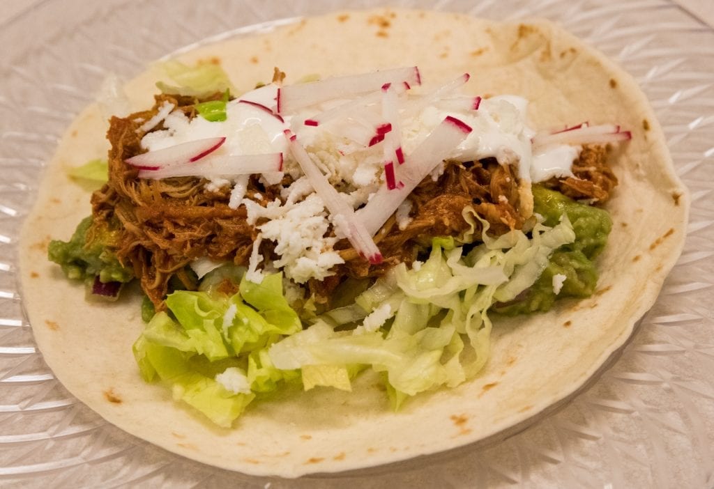 shredded chicken in a tortilla wrap