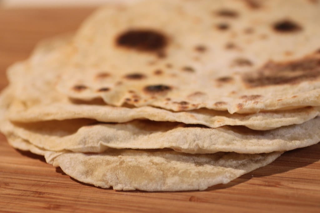 tortillas on a wooden surface