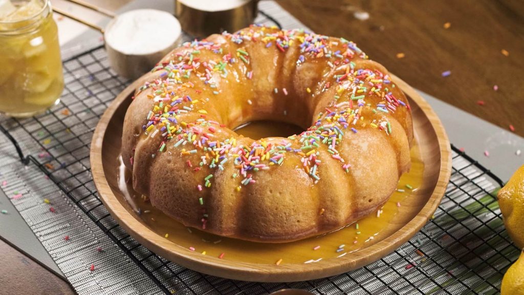 bundt cake with rainbow sprinkles and lemon syrup